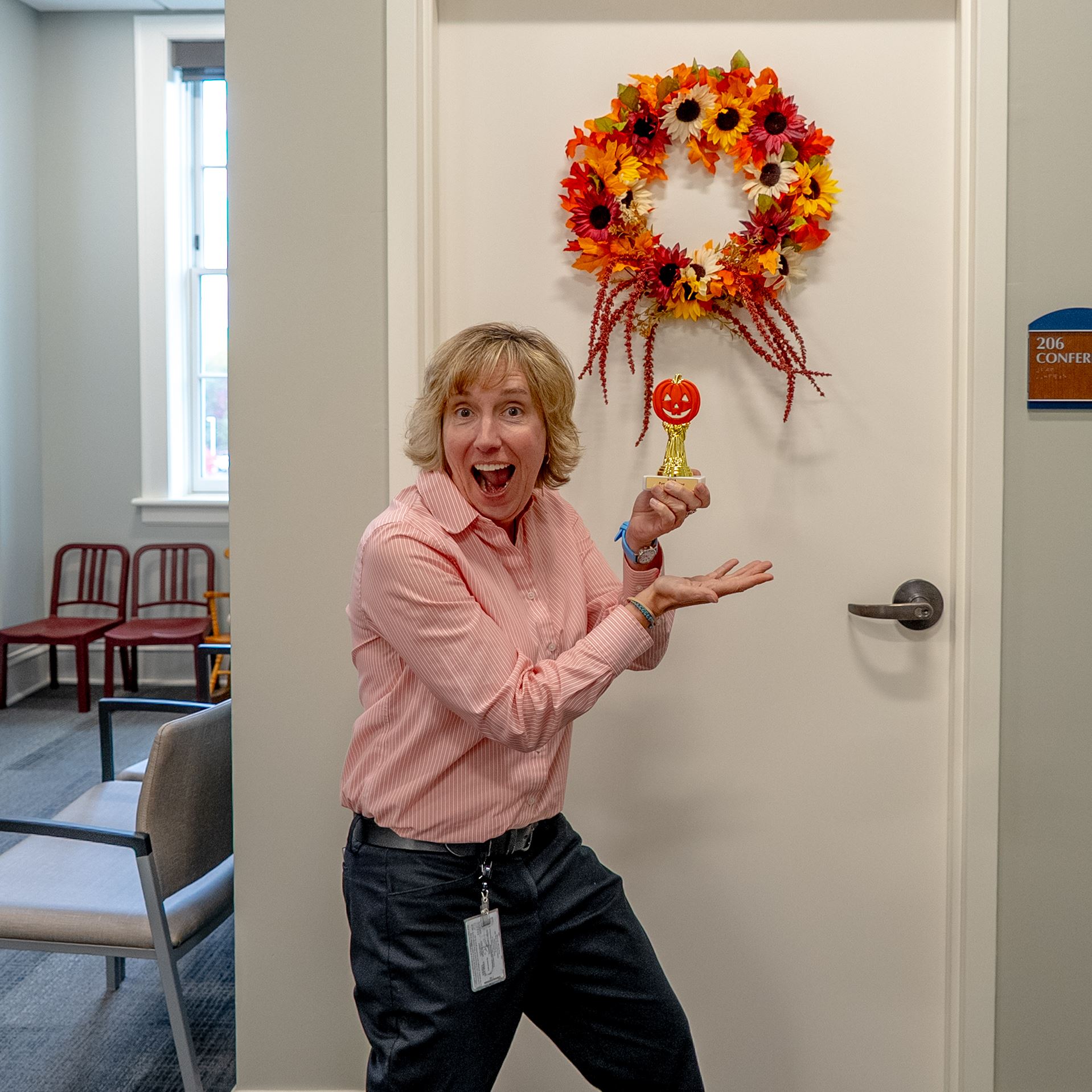 woman with pumpkin trophy